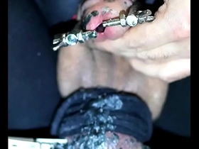 Branding peehole and cock head with incense stick burning hot while pig slave is moaning in suffering through this urethra torment on the stretched burnt piss slit
