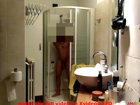 He is spied on playing with his huge cock in the bathroom