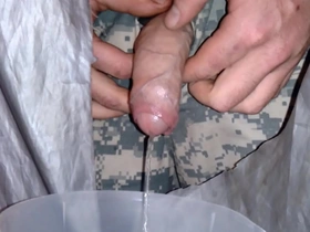 Army guy takes piss through gloryhole
